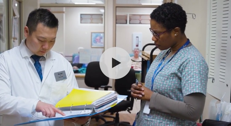 Video preview image of two nurses discussing paperwork